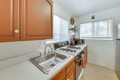 a kitchen with a sink and a stove at Fullerton Home Base Easy Access to Dtwn and CSUF! in Fullerton