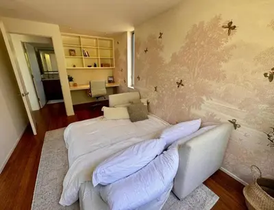 a bedroom with a large white bed with pillows at Venice Walk Street Retreat Jacuzzi and Lemon Tree in Los Angeles