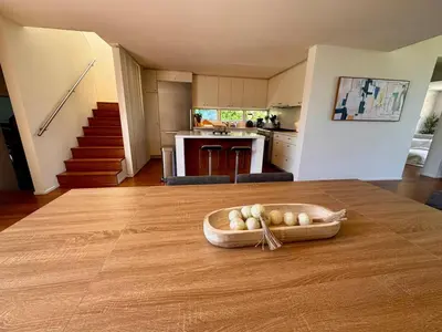 a kitchen with a bowl of onions on a table at Venice Walk Street Retreat Jacuzzi and Lemon Tree in Los Angeles