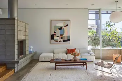 a living room with a couch and a fireplace at Architectural Walk Street Home Venice Elegance in Los Angeles