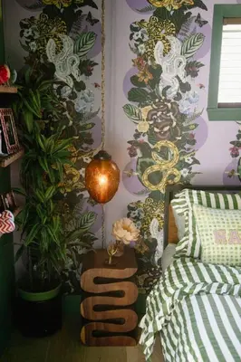 a bedroom with a wall covered in floral wallpaper at Casa Cleopatra Bold Design, Pool and Privacy in Los Angeles