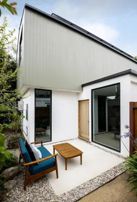 a home with a patio with two chairs and a table at Modern Mar Vista Hideaway New TwoStory ADU in Los Angeles