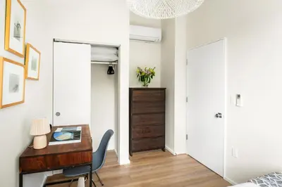 a bedroom with a desk and a bedroom with a bed at Modern Mar Vista Hideaway New TwoStory ADU in Los Angeles