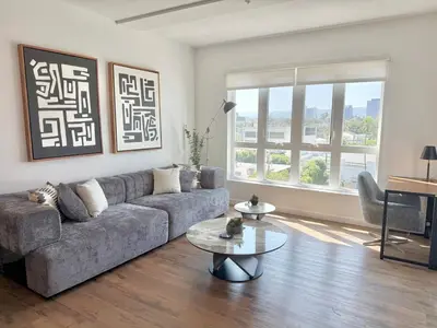 a living room with a couch and a table at Westwood Penthouse 3 Bedroom 2 Bath w Gym, Balcony, Parking in Los Angeles
