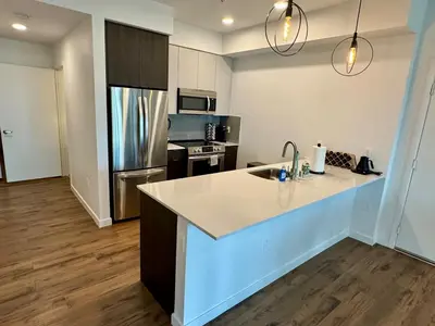 a kitchen with a sink and a counter top at Westwood Penthouse 3 Bedroom 2 Bath w Gym, Balcony, Parking in Los Angeles