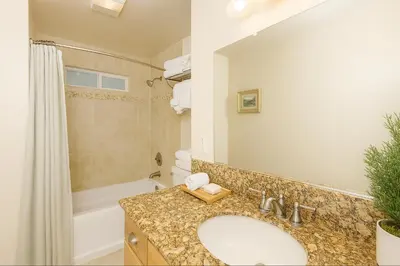 a bathroom with a sink and a shower and a tub at Cozy Cabin with Large Backyard Near Lake, Village and Snow Summit in Big Bear Lake