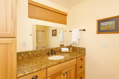 a bathroom with a sink and a mirror at Cozy Cabin with Large Backyard Near Lake, Village and Snow Summit in Big Bear Lake