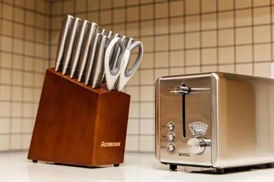 a knife block filled with utensils next to a toaster at Spectacular LOFT in Heart of LA with GYM, Pool, parking in Los Angeles