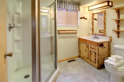 a bathroom with a shower and a toilet and a sink at Gold Rush in Big Bear Lake