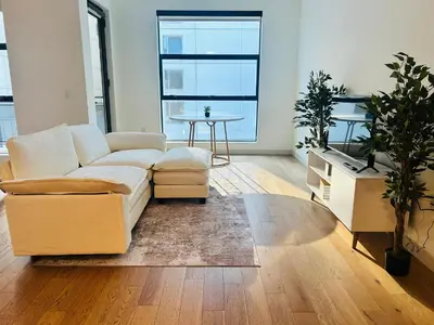 a living room with a couch and a table at Chic Hollywood Dream Large Studio in Los Angeles