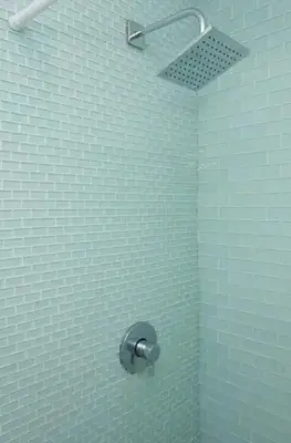 a shower in a bathroom with blue tiles at Amenity-Rich Abbot Kinney Venice Oasis! in Los Angeles