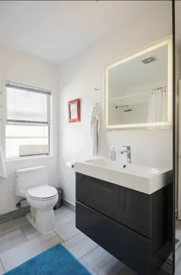 a bathroom with a sink and a toilet at Amenity-Rich Abbot Kinney Venice Oasis! in Los Angeles