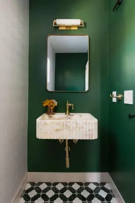 a green bathroom with a sink and a mirror at Modern and Charming Luxe Home in Los Angeles in Altadena