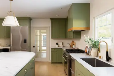 a kitchen with green cabinets and a sink at Modern and Charming Luxe Home in Los Angeles in Altadena