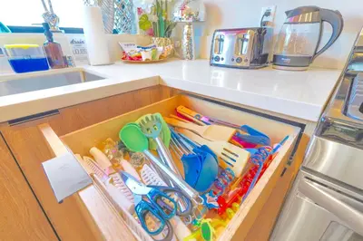 a drawer in a kitchen with scissors and other utensils at H- Fab Family 5BD 4,5BA NoHo Escape Near Universal with Games, Deck, Parking in North Hollywood