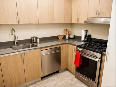 a kitchen with a sink and a stove at Urban Chic residence in Central LA in Los Angeles