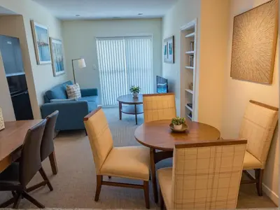 a living room with a table and chairs at Urban Chic residence in Central LA in Los Angeles