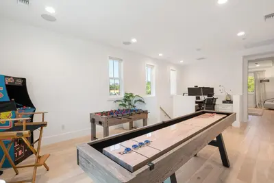 a living room with a ping pong table in it at 4mil WestLA Lux Manor Santa Monica and Beverly Hills in Los Angeles