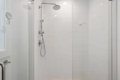 a bathroom with a shower with a glass door at 4mil WestLA Lux Manor Santa Monica and Beverly Hills in Los Angeles