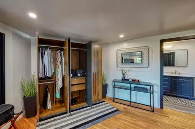 a room with a dresser and a mirror at Koda House in Lake Arrowhead