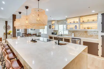 a large kitchen with a large marble counter top at Patio, Fire Pit and Hillside Views Agua Dulce Home in Leona Valley