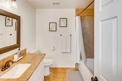 a bathroom with a sink and a toilet at Patio, Fire Pit and Hillside Views Agua Dulce Home in Leona Valley