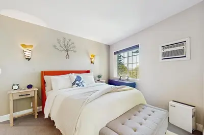 a bedroom with a large bed and a window at Lakeview Lookout in Skyforest