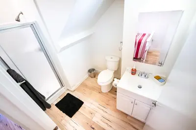 a bathroom with a toilet and a sink at Modern 2 Bedroom 3 Level Loft by Hollywood Close to Downtown LA Free Gated Parking Full Kitchen in Los Angeles