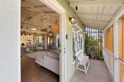 a living room with a couch and a table at Silver Lake Cozy Getaway in Los Angeles