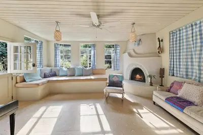 a living room with a couch and a fireplace at Silver Lake Cozy Getaway in Los Angeles