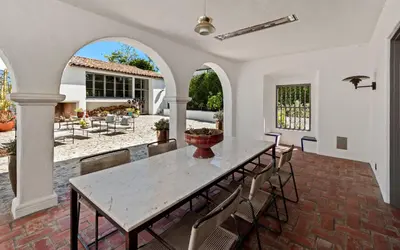 a dining room with a table and chairs at Howard Hughes Estate in Los Angeles