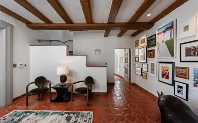 a living room with a table and chairs at Howard Hughes Estate in Los Angeles
