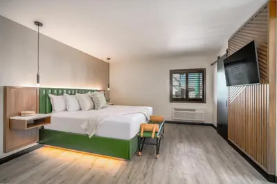 a bedroom with a bed and a flat screen tv at LYFE INN & SUITES by AGA- North Hollywood Near Universal Studios in North Hollywood