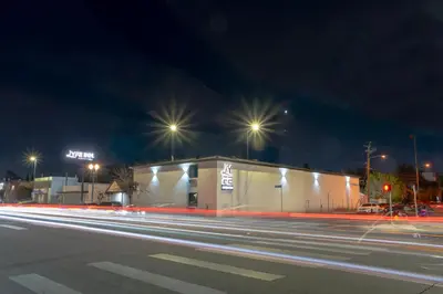 a building on a street at night with street lights at LYFE INN & SUITES by AGA- North Hollywood Near Universal Studios in North Hollywood