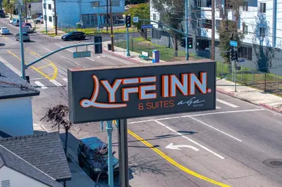 a sign for ayr inn and suites on a city street at LYFE INN & SUITES by AGA- North Hollywood Near Universal Studios in North Hollywood
