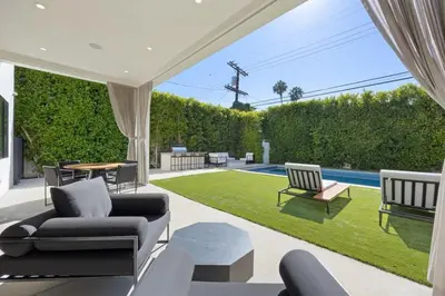 a living room with a couch and chairs and a yard at The Artezen Villa by Stay Awhile Villas in Los Angeles