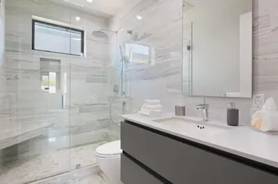 a white bathroom with a sink and a shower at The Artezen Villa by Stay Awhile Villas in Los Angeles