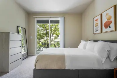 a bedroom with a large white bed and a window at Blueground Playa Vista pool nr Ballona Creek LAX-1376 in Los Angeles