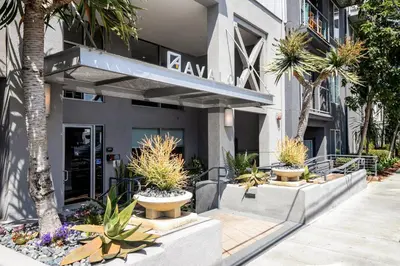 a building with trees and plants in front of it at Blueground Playa Vista pool nr Ballona Creek LAX-1376 in Los Angeles