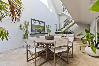 a dining room with a table and chairs at Hollywood Hills Luxury Retreat in Los Angeles