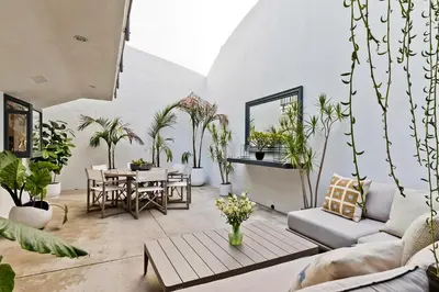 a living room filled with lots of plants at Hollywood Hills Luxury Retreat in Los Angeles