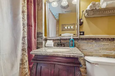 a bathroom with a sink and a mirror at Idle Ours Cabin ~ Rustic and Cozy Cabin with Fireplace & Private BBQ - Walk to Big Bear Lake in Fawnskin