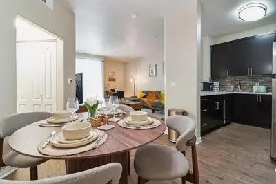 a dining room and living room with a table and chairs at Modern 1bd apt in Marina del Rey w Free Parking in Los Angeles