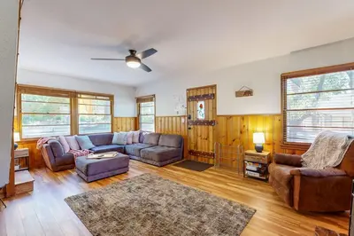 a living room with a couch and a chair at Quiet Cabin ~ End of Cul-De-Sac Location Private Hot Tub, Fenced Yard, Boat Parking in Big Bear Lake