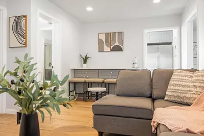 a living room with a couch and a table at #Marbella lane - Serene Haven Retreat 3BR in Ontario