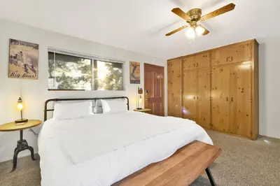 a bedroom with a bed and a ceiling fan at Orchard Family Cabin Near Historic Big Bear Village Walk to Marina in Big Bear Lake