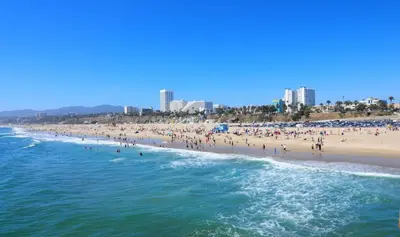 a group of people on a beach near the ocean at Spacious 3 bedroom home by Melrose and 10 minutes to Hollywood Walk of Fame in Los Angeles