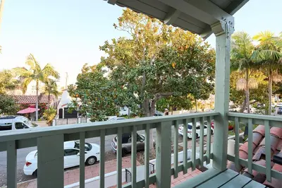 a balcony with cars parked in a parking lot at Beach Life in Belmont Shore in Long Beach