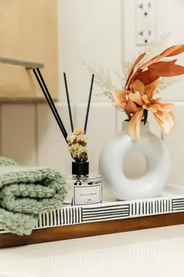 a shelf with a vase and flowers on it at Palm & Vine MODERN COZY LOFT in HOLLYWOOD, FREE Parking in Los Angeles