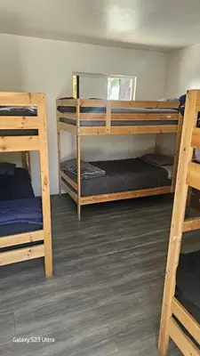 a room with three bunk beds in it at ElMonte Soul in El Monte